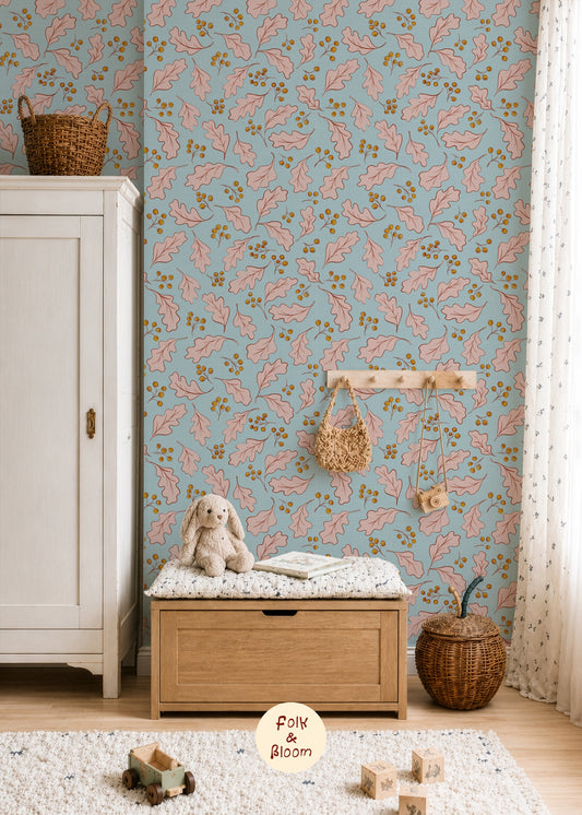 Blue nursery wallpaper with pink oak leaves by Folk & Bloom